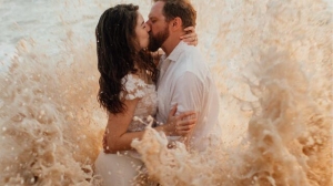 Couple’s beach wedding photo shoot goes viral after ocean tide ruins bride’s dress