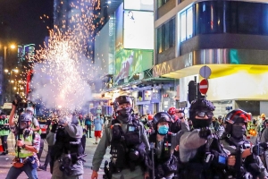 Hong Kong police fire tear gas as black-clad protesters return to streets