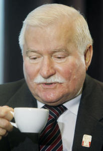 Poland’s former president and Solidarity founder, Lech Walesa, takes a sip of tea before talking to The Associated Press in Warsaw, Poland, on Friday, May 23, 2014 on the sidelines of a conference of an organization of engineers and appraisers, SIDiR, that he addressed. Walesa told the AP that the United States under President Obama is not a world leader anymore, at a time when leadership is needed. (AP Photo/Czarek Sokolowski)