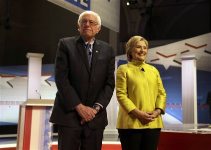Democratic presidential candidates Sen. Bernie Sanders, I-Vt, left, and Hillary Clinton take the stage before a Democratic presidential primary debate at the University of Wisconsin-Milwaukee, Thursday, Feb. 11, 2016, in Milwaukee. (AP Photo/Tom Lynn)