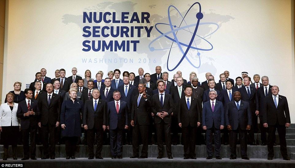 Peace out, fools! Obama plays the clown by flashing the peace sign for nuclear security summit 'team photo'... and gets a very unimpressed look from David Cameron and bemused world leaders