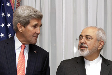 FILE - In this March 16, 2015 file photo U.S. Secretary of State John Kerry, left, listens to Iran's Foreign Minister Mohammad Javad Zarif, right, before resuming talks over Iran's nuclear program in Lausanne, Switzerland. The State Department said Kerry and Iran's Foreign Minister Mohammad Javad Zarif would meet Monday, April 27, 2015 at the United Nations on the sidelines of a conference on the nuclear non-proliferation treaty in which both men are participating. (AP Photo/Brian Snyder, Pool, File)