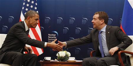 U.S. President Barack Obama shakes hands with Russian President Dmitry Medvedev in a bilateral meeting before they both attend the 2012 Nuclear Security Summit later today in Seoul, South Korea, March 26, 2012. REUTERS/Larry Downing