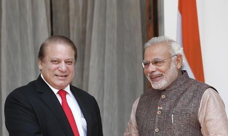 India&#39;s Prime Minister Modi and his Pakistani counterpart Sharif smile before the start of their bilateral meeting in New Delhi
