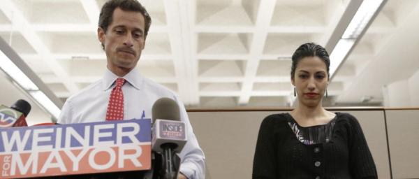 Then-New York mayoral candidate Anthony Weiner speaks during a news conference alongside his wife, Huma Abedin, at the Gay Men's Health Crisis headquarters in New York on July 23, 2013. (Associated Press) **FILE**