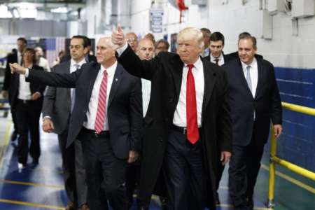 President-elect Donald Trump and Vice President-elect Mike Pence wave as they visit to Carrier factory, Thursday, Dec. 1, 2016, in Indianapolis, Ind. (AP Photo/Evan Vucci)