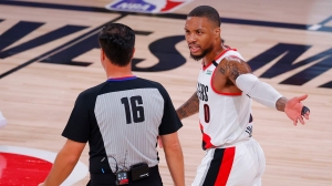 Blazers say Lillard leaving bubble for tests on injured knee