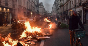 France Burns: Macron Signs Pension Reform into Law as Paris Riots