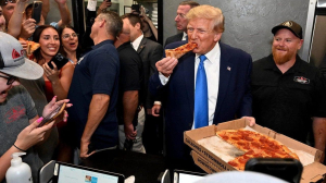 Trump makes surprise visit to Florida pizza place, hands out slices to supporters
