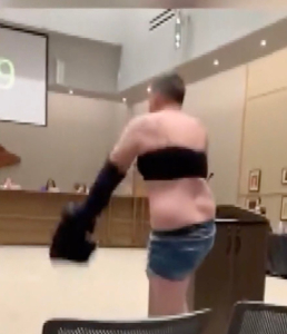 Dad strips down to crop top, Daisy Dukes at school board meeting to protest lax dress code